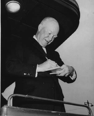 Eisenhower signs autographs 